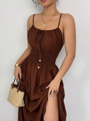 Brown smocked spaghetti-strap midi dress, angled view