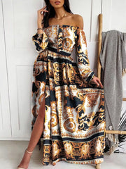 Back view of the black and gold patterned maxi dress with long sleeves.
