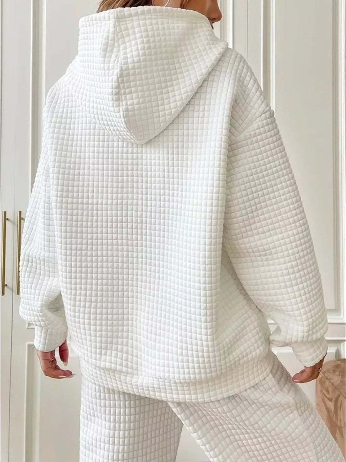 Back view of white textured hooded sweatshirt