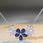Silver-tone flower necklace with blue center stones