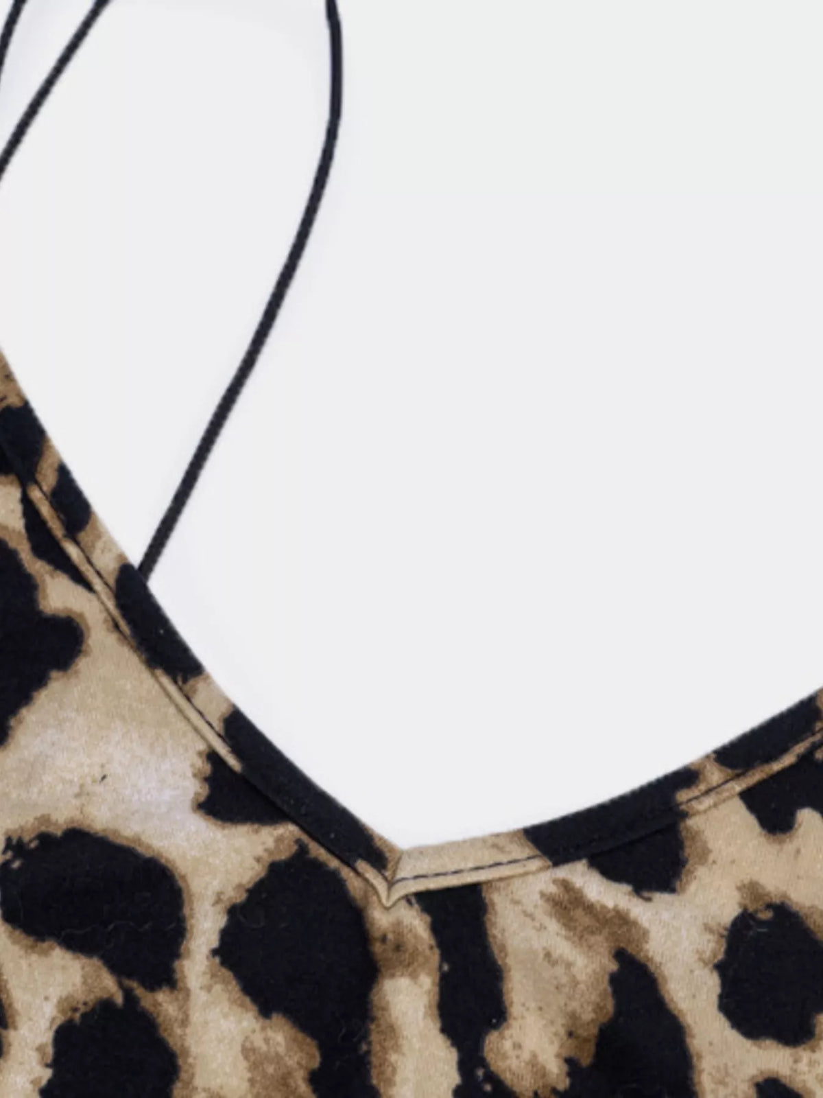 Close-up of leopard print dress neckline and straps