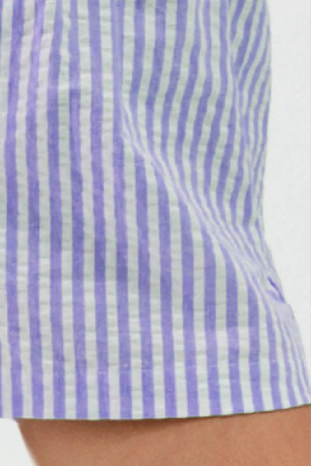 Close-up of violet vertical stripes and leg opening