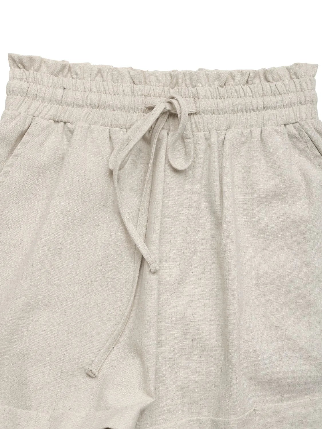Close-up of gathered drawstring waist and frill trim