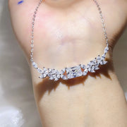 Close-up of the floral moissanite pendant and stone details