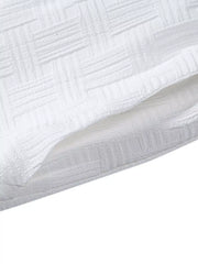 Close-up of subtle raised linear texture in white shorts fabric