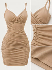 Beige mini dress shown alone from the front, highlighting the wrap bodice and all-over ruching.