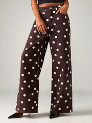 Rear angled view of cream jeans with black polka dots
