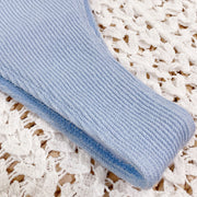 Close-up of light blue ribbed bikini fabric texture