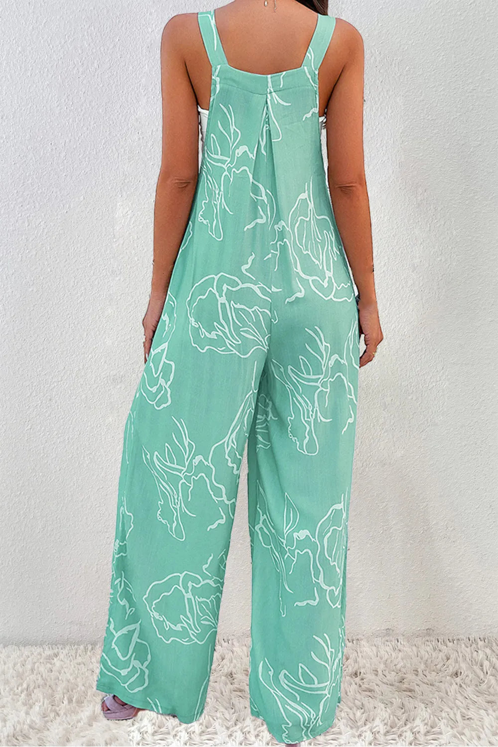Back view of turquoise printed jumpsuit