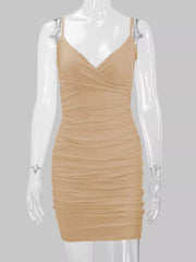 Beige spaghetti-strap ruched bodycon mini dress displayed front-facing on a mannequin.