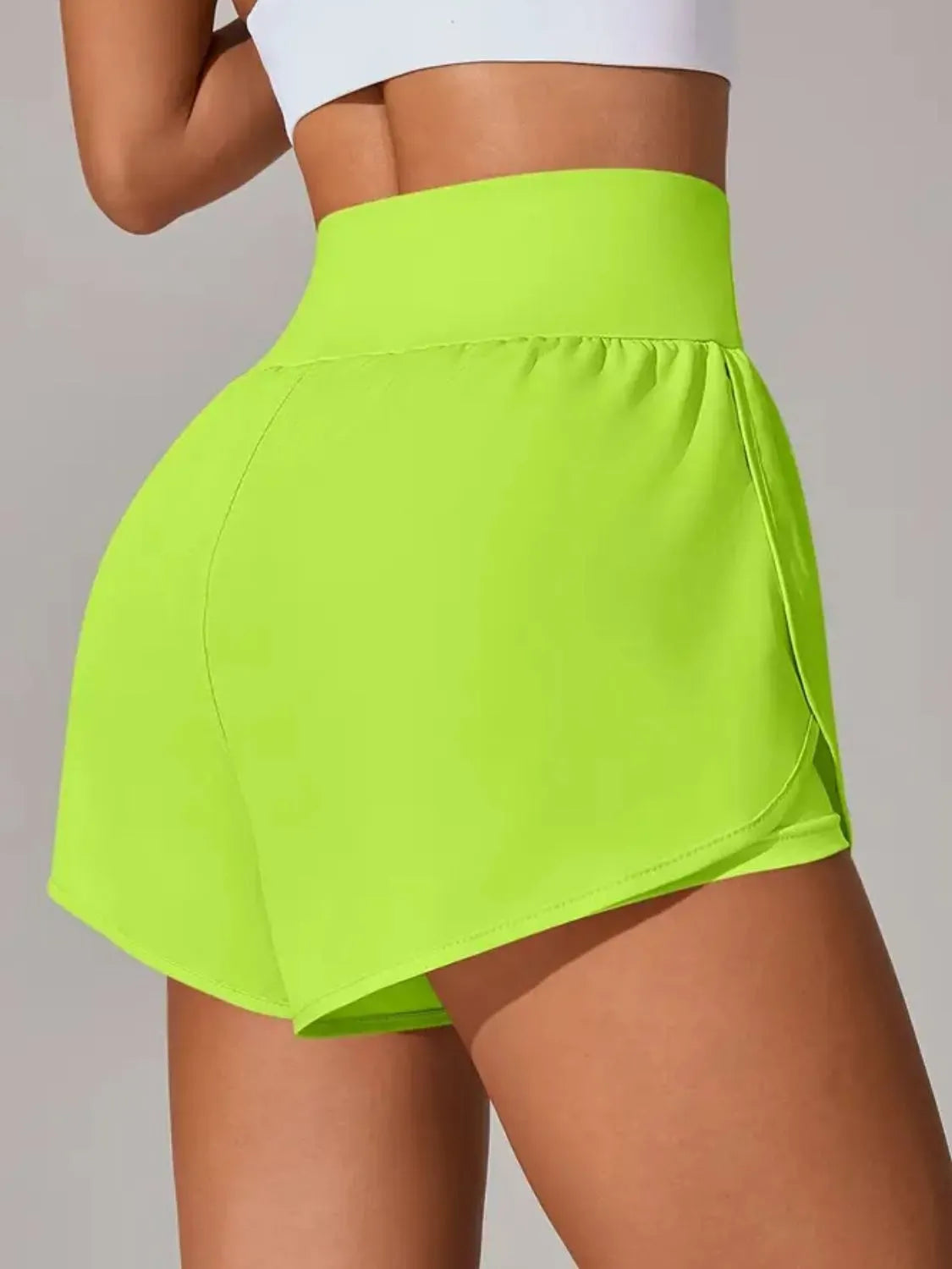 Back view of neon lime running shorts and wide waistband