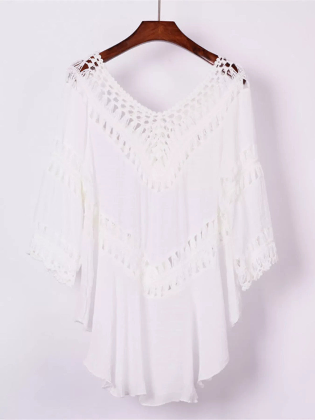 Close view of crochet trim on the white cover-up dress