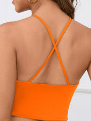 Back view of orange halter crop cami with crossed straps