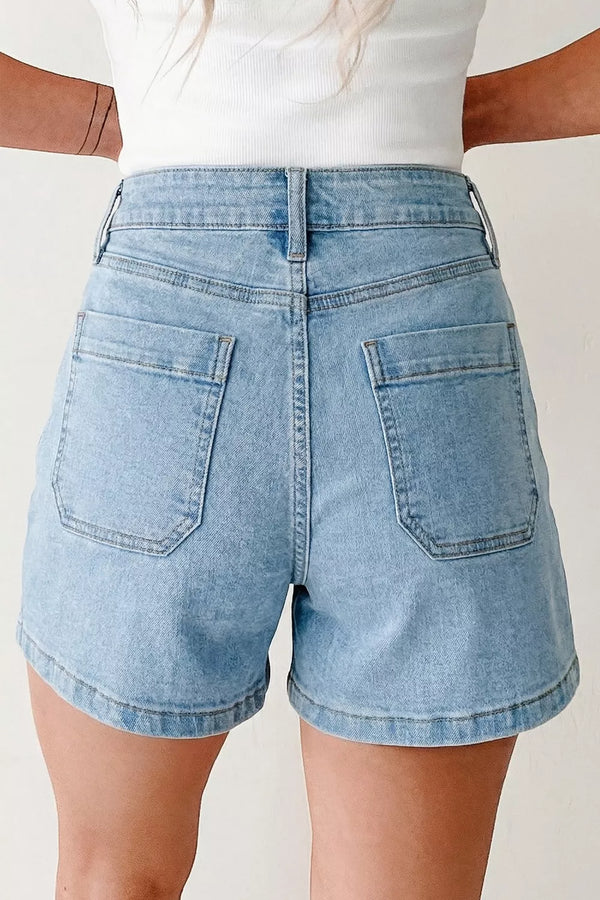 Back view of light-blue high-rise denim shorts with patch pockets