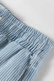 Close detail of the fine blue-and-white stripes and elastic waistband.