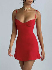 Model wearing the red sweetheart-neck mini dress with a fitted bodice and short skirt.