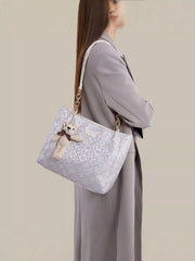 Jacquard tote carried over a shoulder