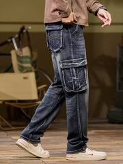 Side view of dark washed cargo jeans with large flap pocket