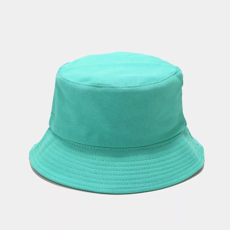 Mint green solid-color bucket hat shown from the front with stitched brim