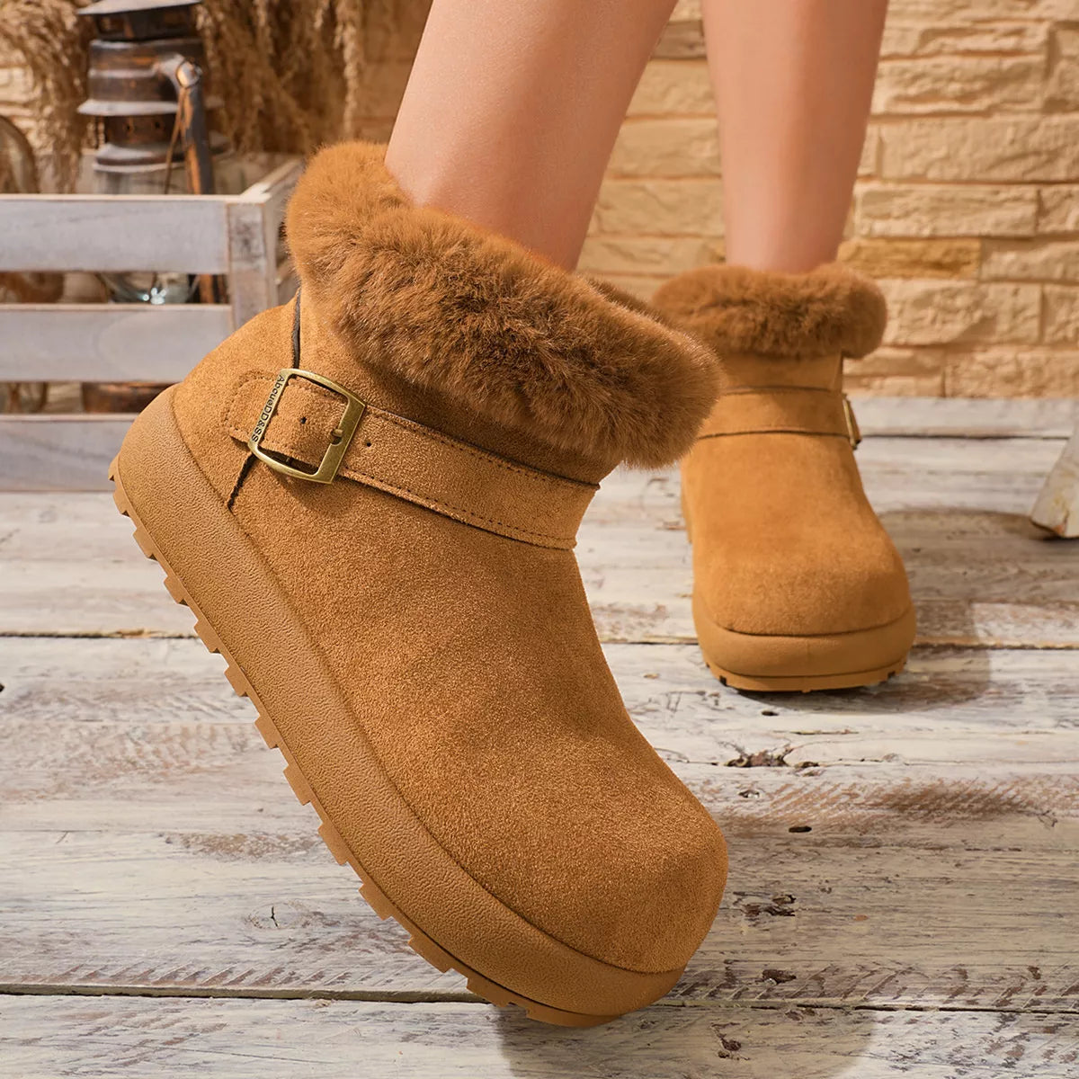 Brown faux-fur cuff and buckle detail on ankle boot