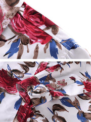 Close-up of red rose and blue floral shirt fabric