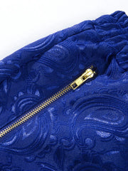 Close-up of blue paisley fabric and gold-tone zipper