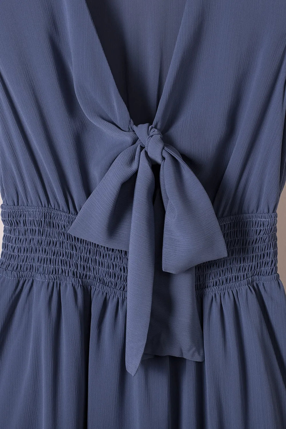 Close-up of front tie and smocked waist