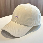 Beige cotton baseball cap with small Hello embroidery on front