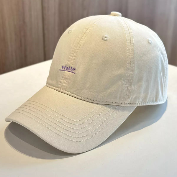 Beige cotton baseball cap with small Hello embroidery on front