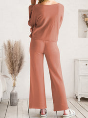 Rust-colored wide-leg lounge pants shown from waist to hem