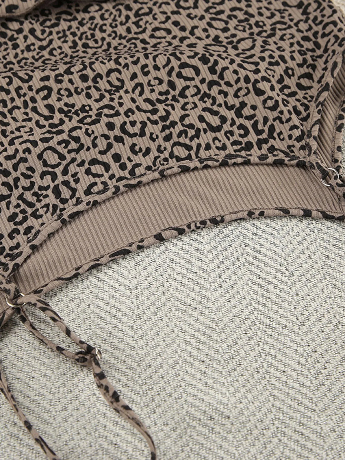 Close view of square neckline on leopard-print camisole