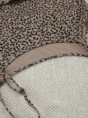 Close view of square neckline on leopard-print camisole