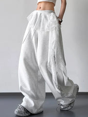 Side view of light gray wide-leg pants with lace overlay