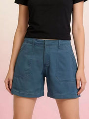 Blue denim shorts with large front patch pockets and stitched hems, front view