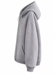Side view of the gray hoodie showing its hood profile and roomy sleeve