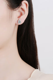 Teardrop stone stud earring worn on an ear
