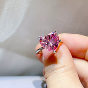 Side view of the pink heart stone above the silver band.