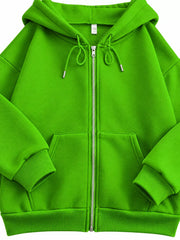 Close-up view of bright green hoodie zipper, drawstrings, cuff and pocket