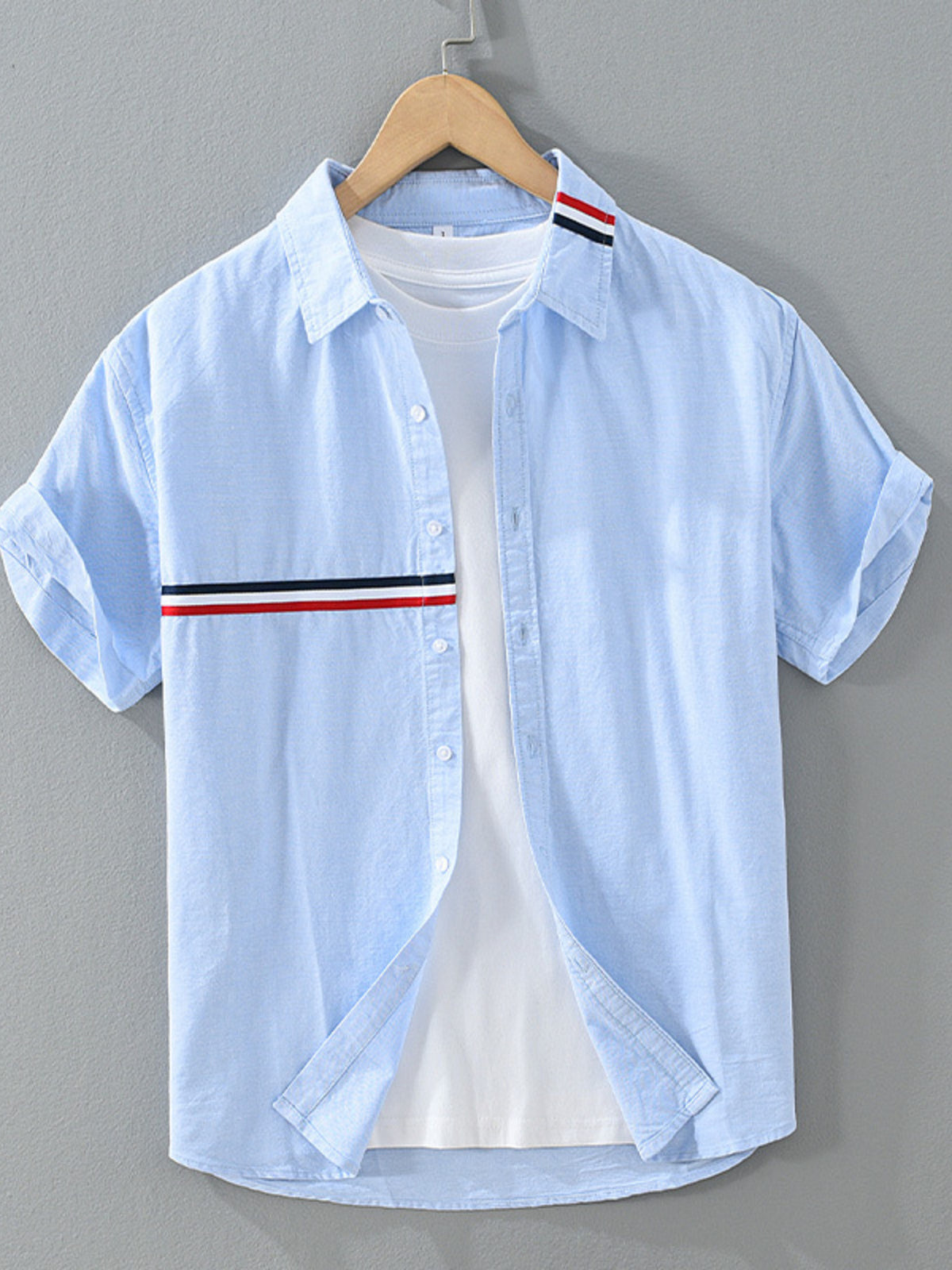 Light blue short-sleeve shirt with red and navy chest and collar stripes