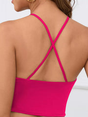 Back view of hot pink halter crop cami with crossed straps