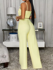 Back view of the light yellow cami and wide-leg pants set, showing the smocked back.
