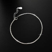 Adjustable sterling silver chain bracelet with extension and clasp on black