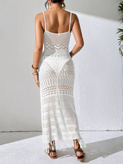Back view of a white openwork cover-up dress showing shoulder straps and patterned bands