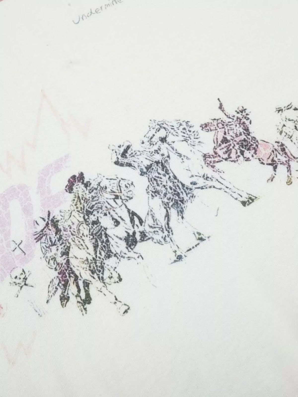 Close-up of black sketch-style graphic on white fabric