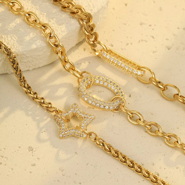 Close-up of chunky gold-tone chain links and rhinestone detail