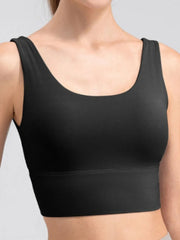 Back view of the black tank with a deep V-shaped neckline
