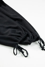 Black jumpsuit ankle hem with adjustable drawstring ties