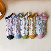 Five white floral ankle sock pairs with contrasting black, blue, green, yellow and pink trims