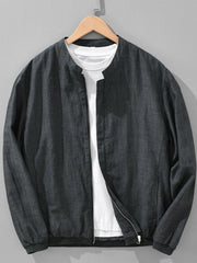 Black zip-up jacket layered over a white shirt