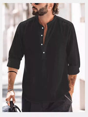 Model wearing a black long-sleeve shirt with a short button placket